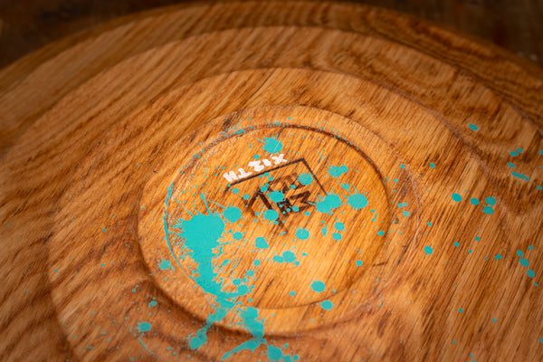 Natural light highlighting the warm tones and texture of the Chase oak vessel