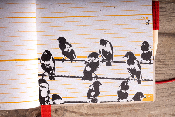 Diary weekly page with an illustration of birds perched on a wire