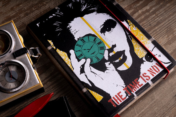cover-close-up.jpg — Close-up angled view of "The Time Is Now" 2027 diary cover artwork