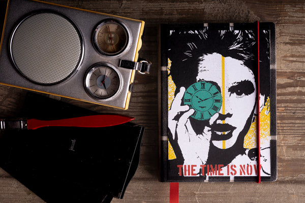 cover-flat-lay.jpg — "The Time Is Now" 2027 diary cover flat lay styled with vintage radio and clock props
