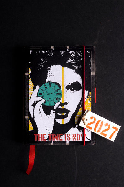 cover-hero.jpg — Deafmessanger "The Time Is Now" 2027 diary cover with clock and face illustration, black background