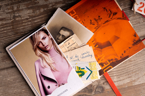 open-diary-photo-insert.jpg — Open diary showing inner pocket with vintage photo and ticket inserts