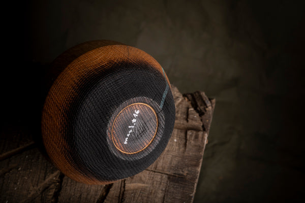 A detail of a wooden hollow form. The vessel is made on the lathe from red oak. 