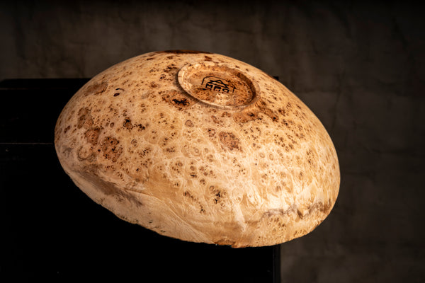 Close-up of the natural edge on the maple burl bowl Evie by Maalström Studio.
