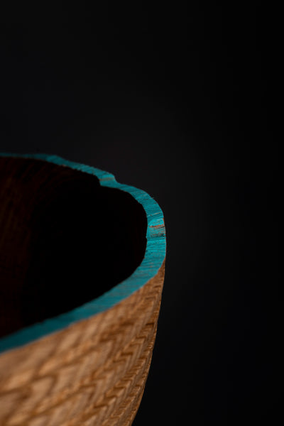 Wooden bowl with a dark background